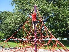 Jacob Wheeler climbing at the playground; Cayuga Lake State park
