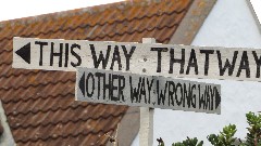 sign <-- This way That Way -->
