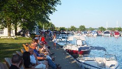 boat mooring and patrons at Canandaigua Inn on the Lake