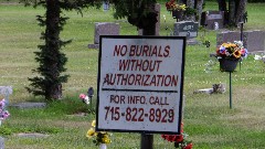 IAT
sign No Burials Without Authorization