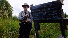 Dan Dorrough; 
sign Official End of the Superior Hiking Trail
Otter Lake Road
Swamp River 1 mi
Border Route Trail 2 mi
Prout Lake 1 7 mi
Jackson Lake Rd 2 0 mi